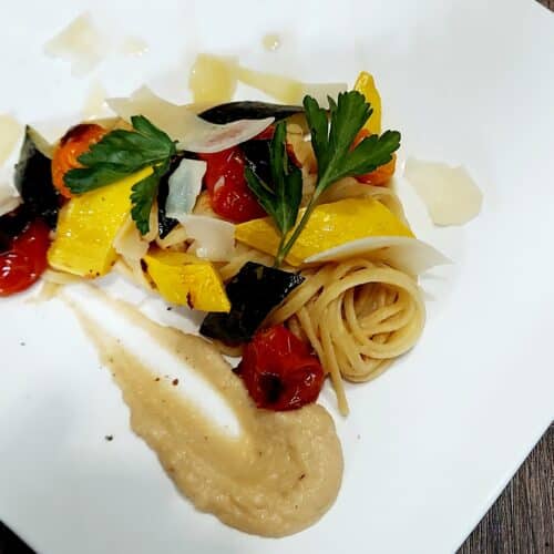 Primavera cauliflower sauce served with pasta and veggies