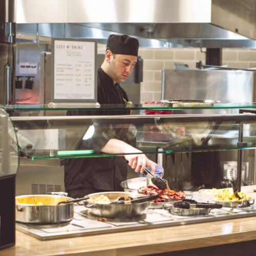 Canteen dining attendant, chef preparing a buffet, dining solutions