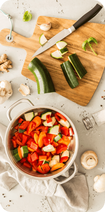 Main Dish, pots and vegetables, cutting boards and knife