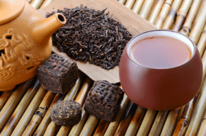 Pu erh tea with dried leaves and blocks