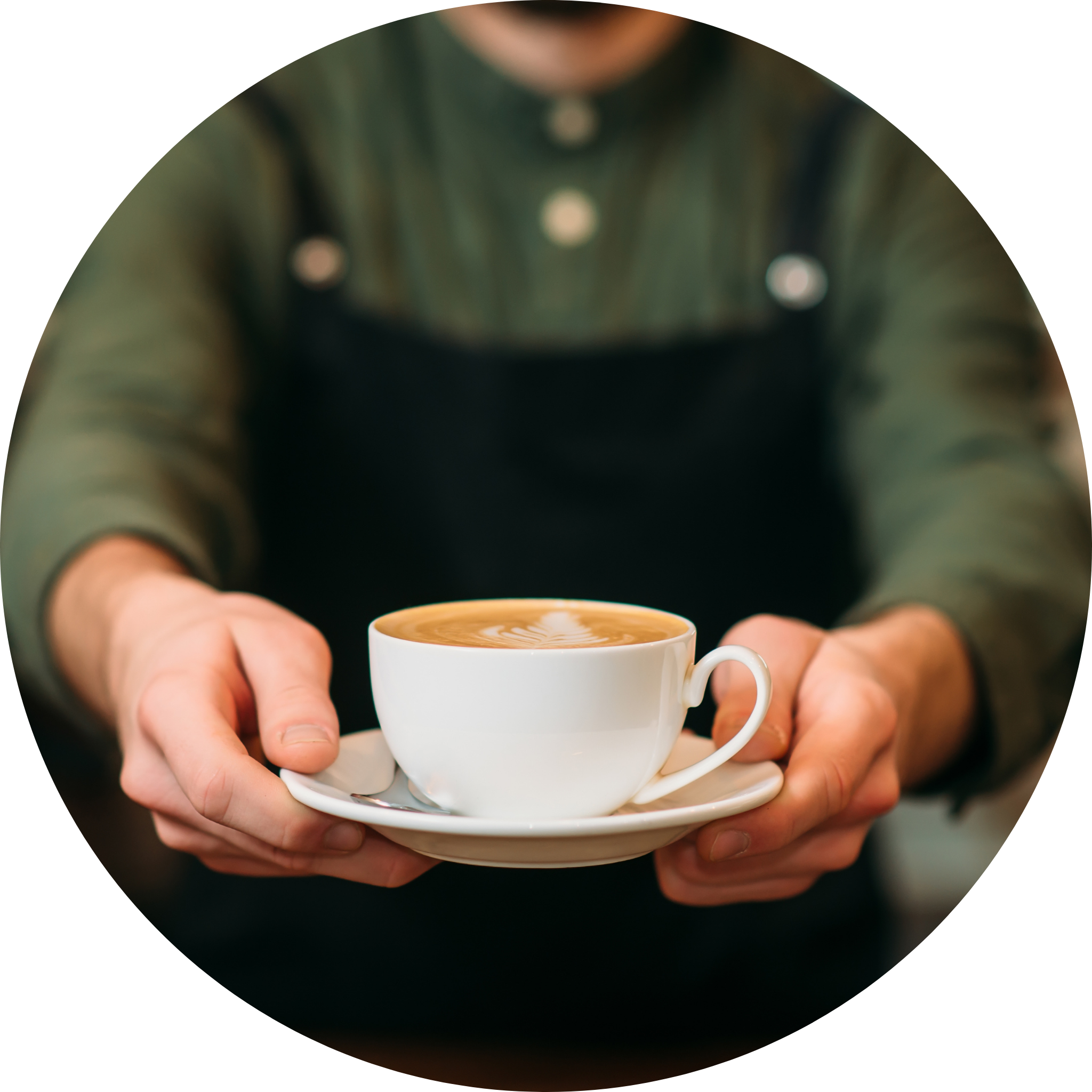 Quality Craft Beverages Circle (1) Barista holding a cappuccino, craft coffee, latte art