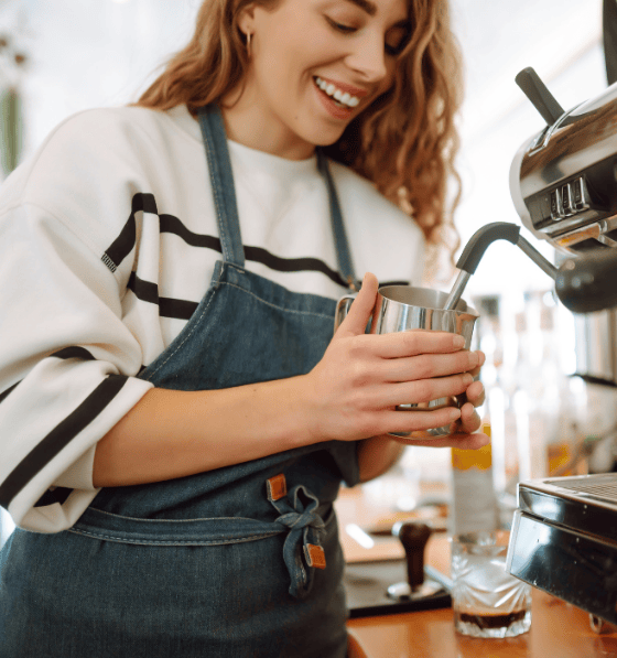 Barista Steaming Milk Barista using coffee machine, Canteen coffee solutions, barista steaming milk