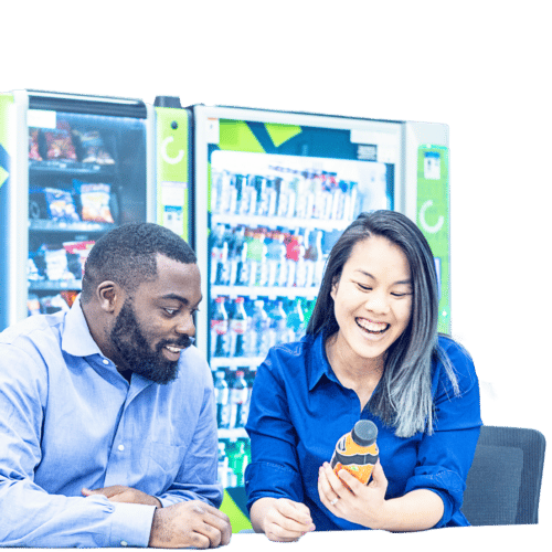 Employees sitting and talking about vending products, vending machines, variety of product options