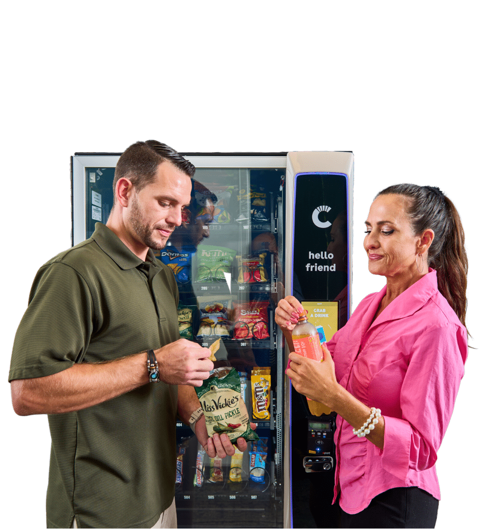 Eating in Front of a Vending Machine Two people eating snacks in front of a Canteen vending machine, snack and drink vending, vending options