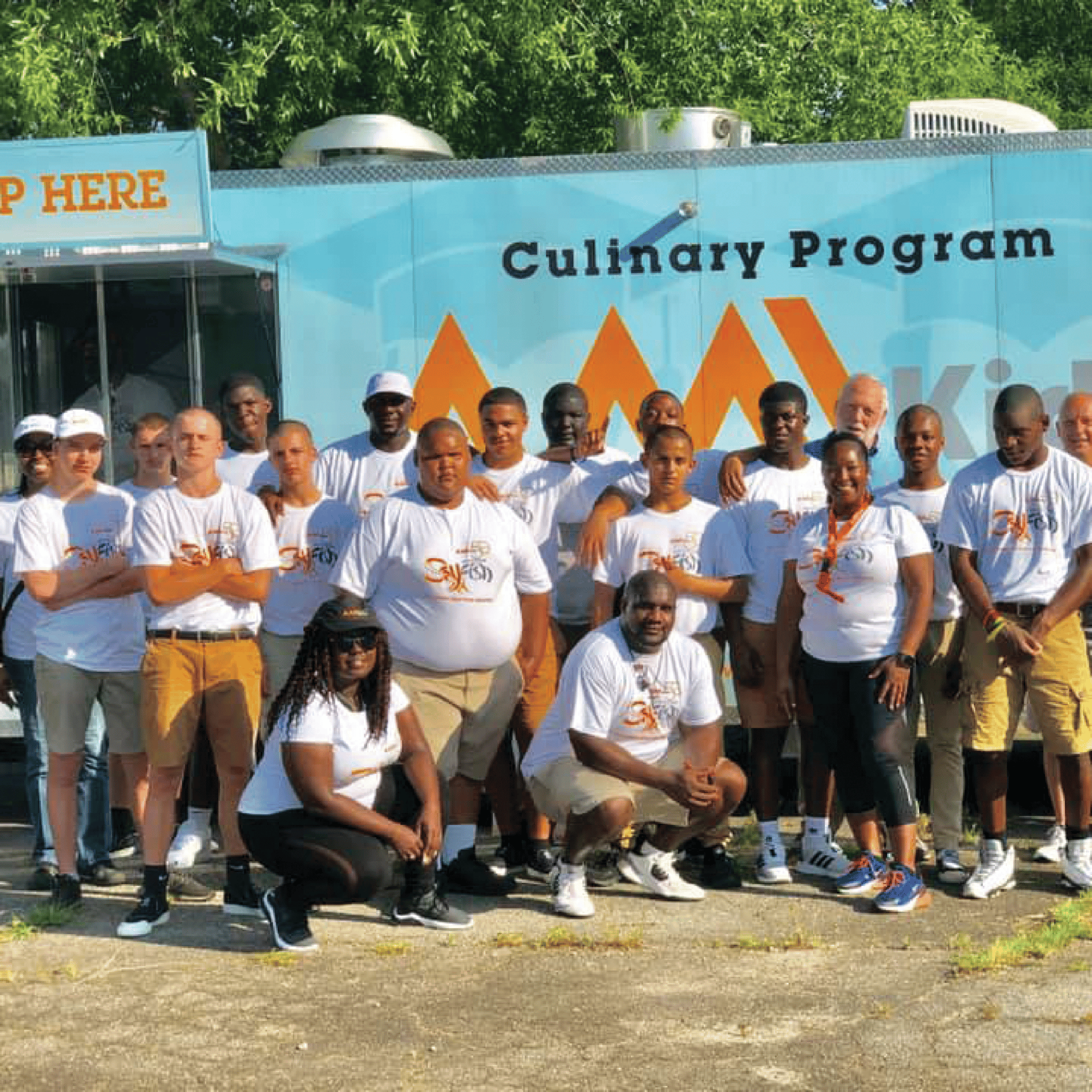 AMIKids AMIKids program in front of a food truck, outside
