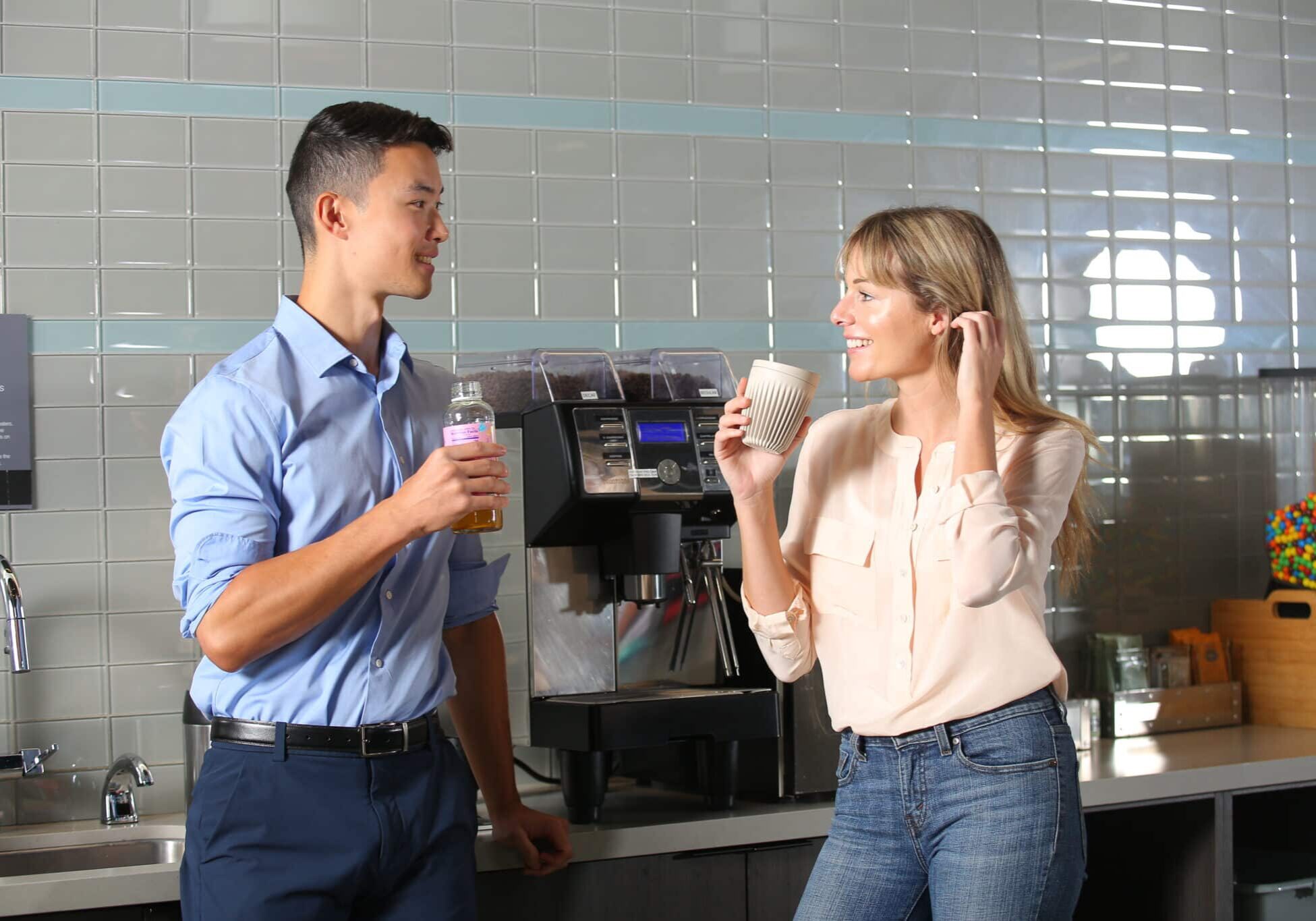 pantry Two people drinking coffee in a Canteen breakroom