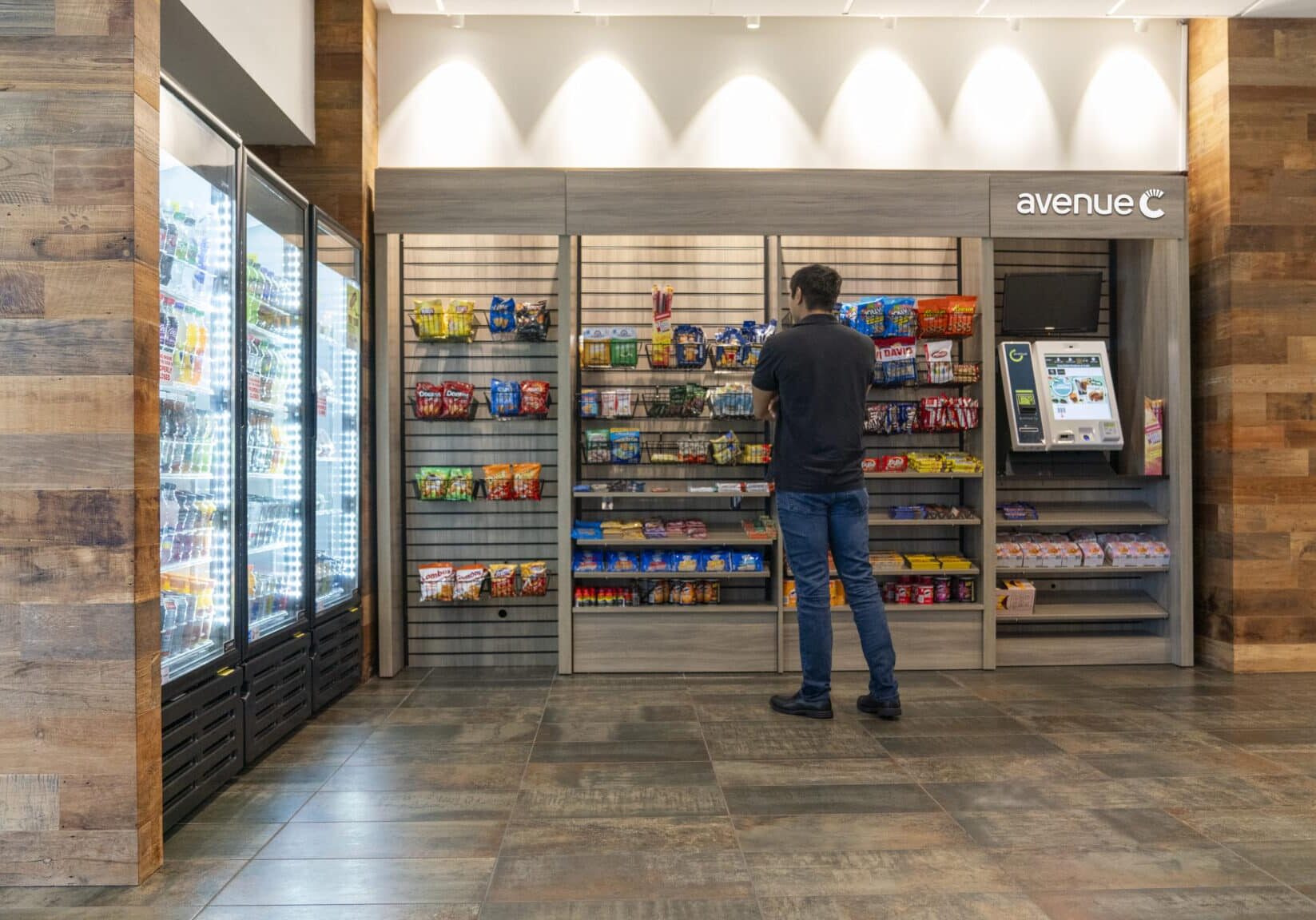 Man at an Avenue C Man standing at an avenue c market and looking at snacks