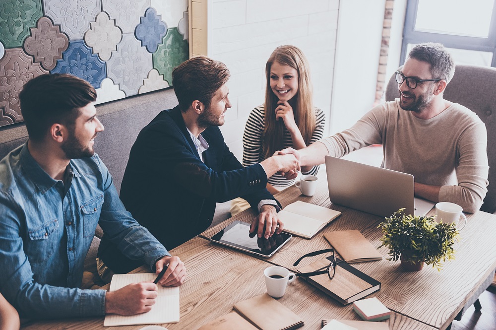 Employees enjoying a cup of coffee in office break room